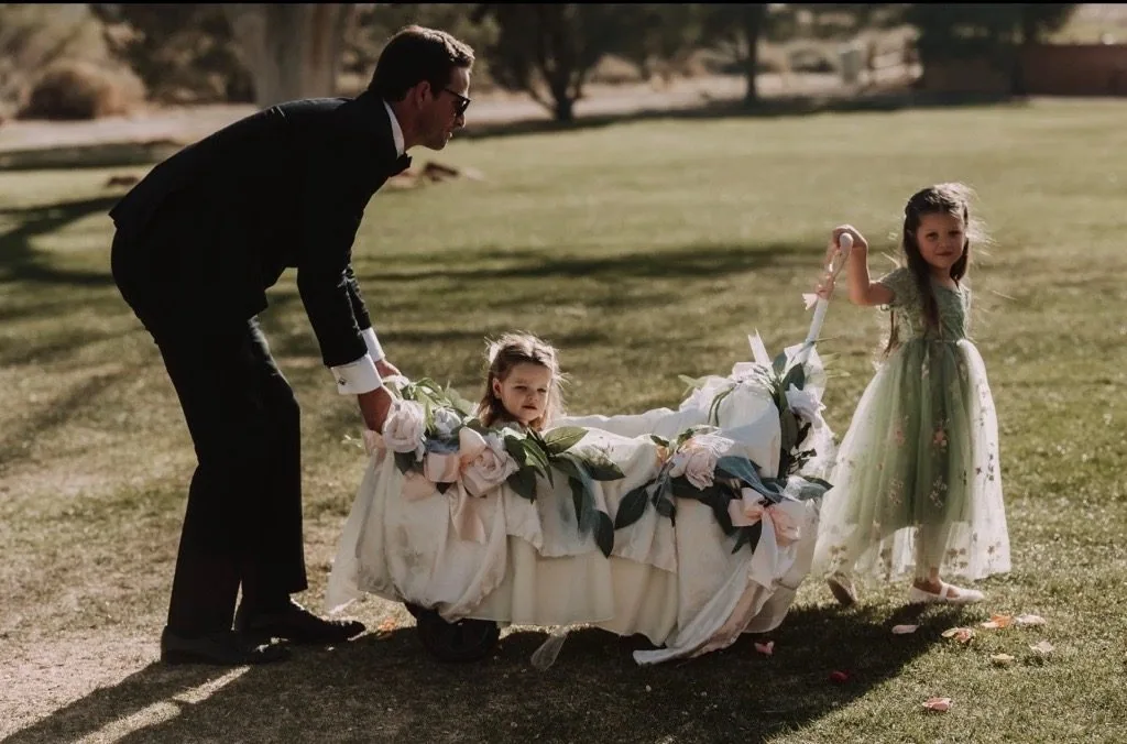 Chris with Isa and her sister at a wedding