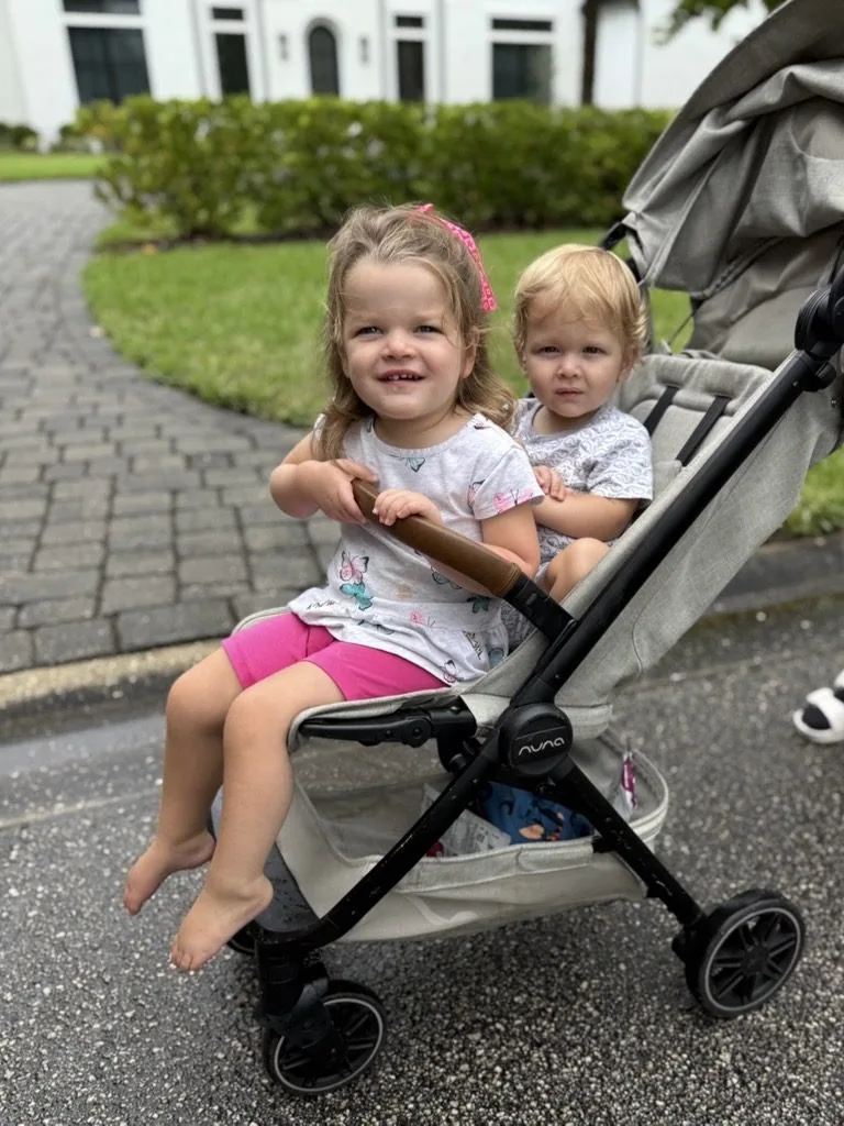 Isa and her baby brother Tripp sharing a stroller